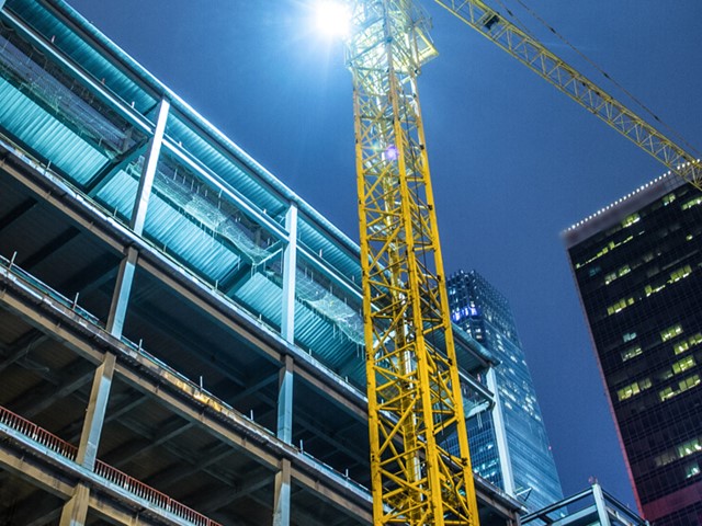 yellow scaffolding  against highrise building 