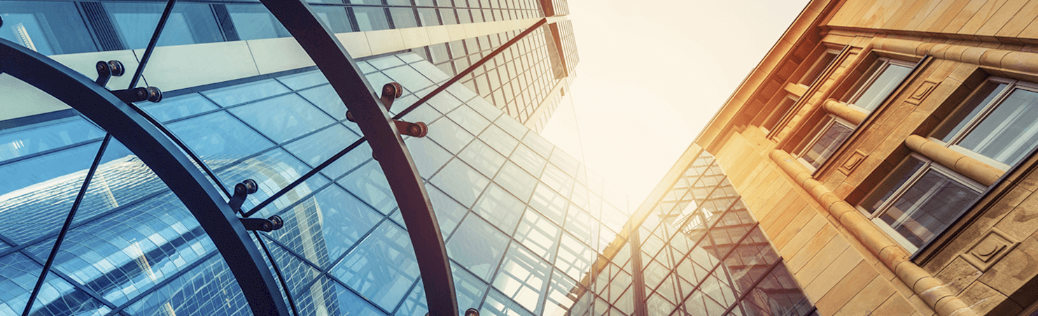 ground level view of tall buildings 