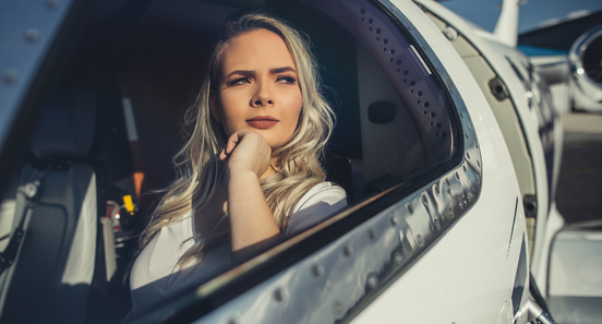 copilot looking out of the window of an airplane 