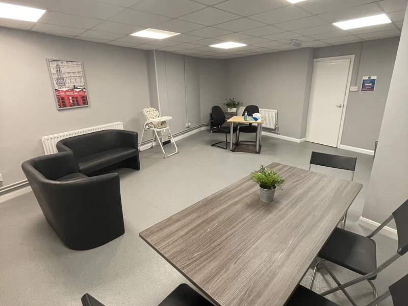 room with seats, table and chairs